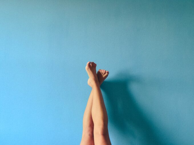 Problematic tenant placing leg on blue wall